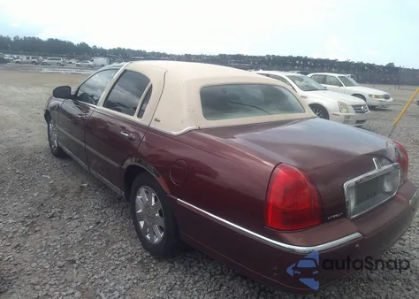 2003 Lincoln Town Car Cartier z USA, uszkodzony, nr VIN 1LNHM83W33Y631168